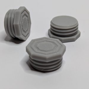 Three gray 3D printed 9mm large thread flat head bolts with hexagonal tops