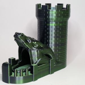 Green and black dual-colour 3D printed dragon castle dice tower with brick texture and crenellated turret