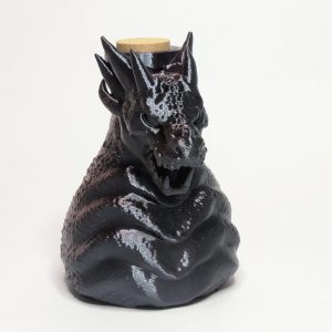 Black dragon-shaped decorative bottle with cork stopper and textured scales
