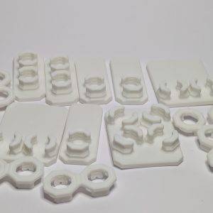 White 3D printed multiboard offset snap connectors and mounting strips in various configurations