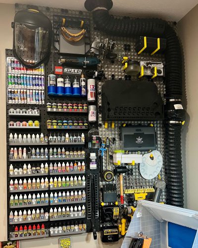 Organized craft room Multiboard wall panels  displaying supplies and tools